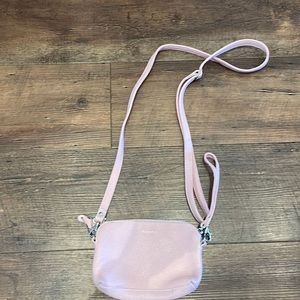 Roots cross body clutch